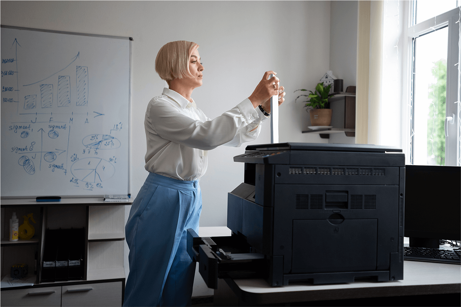 side-view-smiley-woman-using-printer 2