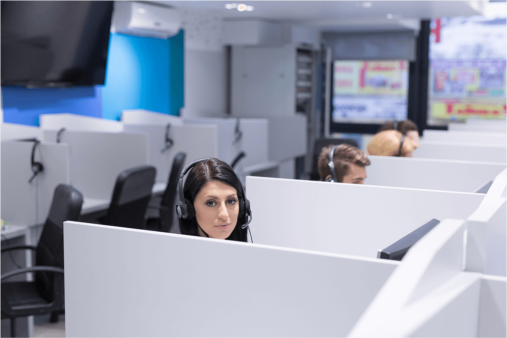 young-smiling-female-call-centre-operator-doing-her-job-with-headset (1)